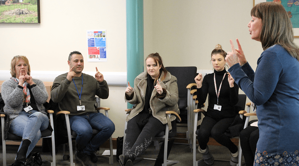 Julie Hawkins teaching Makaton to a class