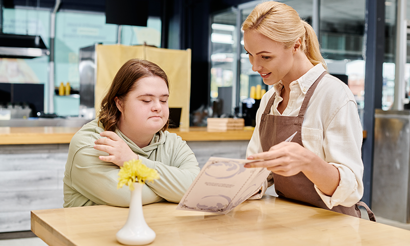 Waitress showing a girl the menu